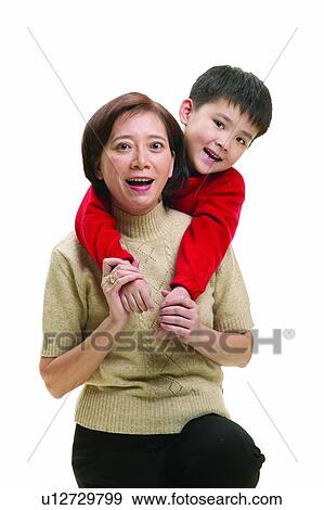 Stock Photo - Indoor, Portrait, Grandmother, Child, Three Generation Family, 6-7 Years. Fotosearch