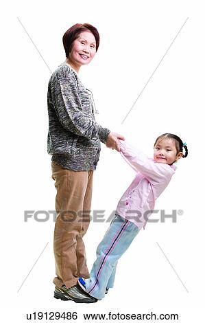 Stock Photograph - Leaning, Short Hair, Asian Ethnicity, Family, Lifestyles, Holding Hands. Fotosearch