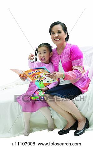 Stock Photo - Sitting, Elementary Age, Childhood, Book, 6-7 Years. Fotosearch
