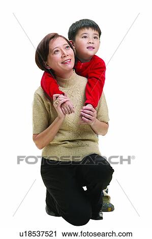 Stock Image - Toothy Smile, Pants, Togetherness, Looking Up, Kneeling, Family. Fotosearch