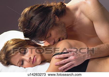 Stock Image - Bed, Close-Up, Brown Hair, Adults Only. Fotosearch