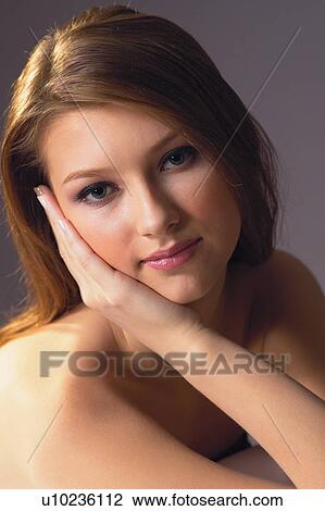Stock Image - Black Background, Brown Hair, Close-Up. Fotosearch