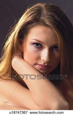 Stock Photo - Black Background, Brown Hair, Close-Up. Fotosearch