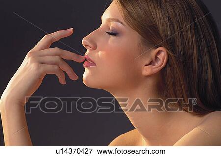 Stock Photo - Black Background, Semi-Dress, Brown Hair, Flirty Couples I. Fotosearch