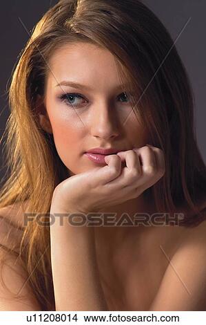 Picture - Hand On Chin, Brown Hair, Medium-Length Hair, Female. Fotosearch