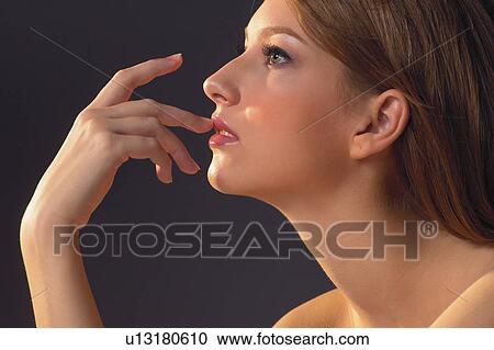 Individuality, One Young Woman Only, Semi-Dress, Finger On Lips, Female, Posing View Large Photo Image Stock Image - Individuality, One Young Woman Only, Semi-Dress, Finger On Lips, Female, Posing. Fotosearch