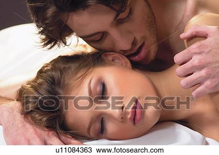 Stock Image - Loving, Semi-Dress, Care, Touching, Young Couple. Fotosearch