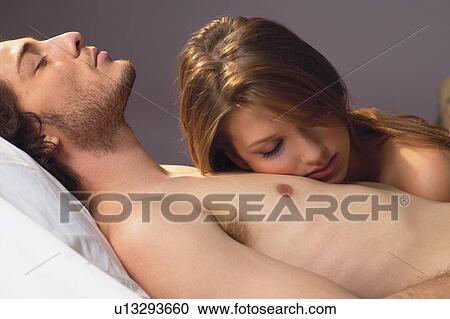 Stock Image - Touching, Two People, Waist-Up, Eyes Closed, Affectionate. Fotosearch