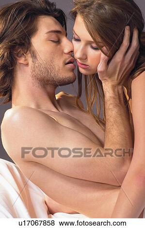 Stock Photo - Young Couple, Semi-Dress, Indoor, Brown Hair. Fotosearch