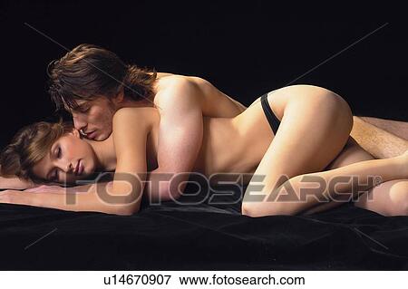Stock Photo - Black Background, Brown Hair, Adults Only. Fotosearch