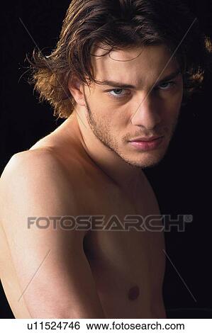 Stock Photograph - Black Background, Brown Hair, Close-Up. Fotosearch