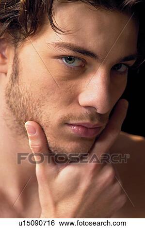 Stock Photograph - Black Background, Brown Hair, Close-Up. Fotosearch