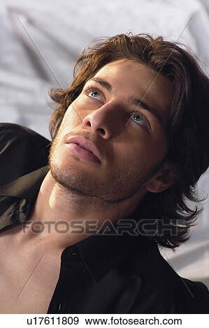 Stock Photo - Brown Hair, Button Down Shirt, Casual Clothing, Close-Up. Fotosearch
