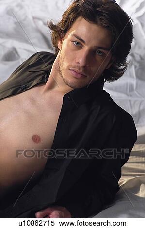 Stock Photography - Brown Hair, Button Down Shirt, Casual Clothing, Close-Up. Fotosearch