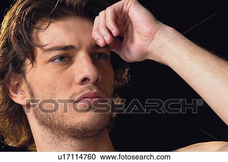 Stock Image - Contemplation, Hand On Head, Flirty Couples II, Desire, Indoor. Fotosearch