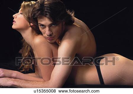 Desire, Sensuality, Heterosexual Couple, Looking At Camera, Indoor, Brown Hair View Large Photo Image Stock Photo - Desire, Sensuality, Heterosexual Couple, Looking At Camera, Indoor, Brown Hair. Fotosearch