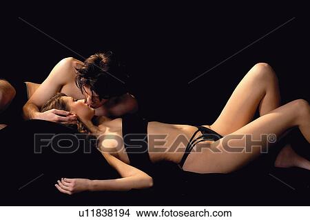 Picture - Desire, Young Adult, Young Women, Semi-Dress, Waist-Up, Sensuality, Lying Down. Fotosearch