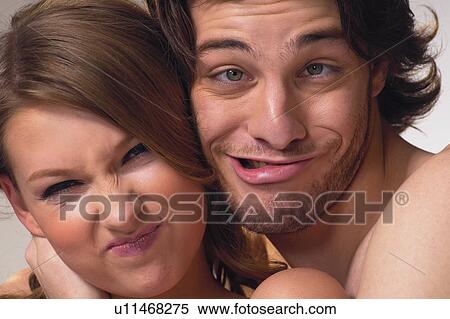 Stock Photography - Heterosexual Couple, Human Face, Brown Hair, Loving, Adults Only, Cheek To Cheek, Touching. Fotosearch