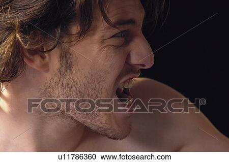Stock Image - One Young Man Only, Semi-Dress, Stress, Black Background, One Person. Fotosearch