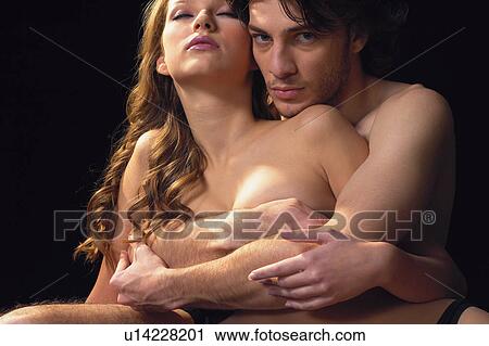 Stock Image - Portrait, Eyes Closed, Black Background, Looking At Camera. Fotosearch