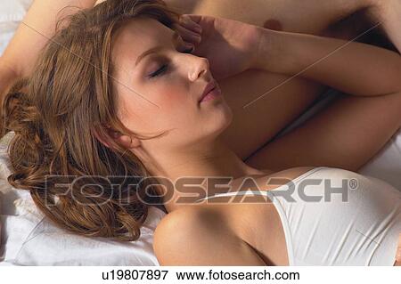 Stock Photo - Arm Raised, Brown Hair, Adults Only. Fotosearch