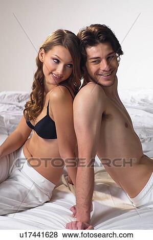 Stock Photo - Back To Back, Bedroom, Bed, Adults Only. Fotosearch