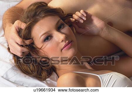 Brown Hair, Resting, Young Adult, Sexual Activity, Semi-Dress, Affectionate View Large Photo Image Picture - Brown Hair, Resting, Young Adult, Sexual Activity, Semi-Dress, Affectionate. Fotosearch