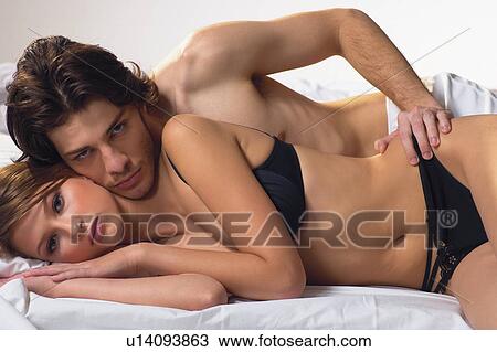 Couple, Relaxation, Portrait, Bed, Sensuality, Sexual Activity View Large Photo Image Stock Image - Couple, Relaxation, Portrait, Bed, Sensuality, Sexual Activity. Fotosearch