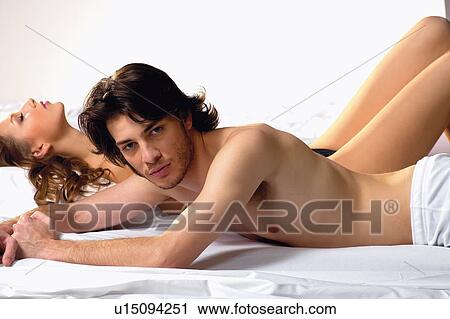 Indoor, Heterosexual Couple, Looking At Camera, Young Couple, Affectionate View Large Photo Image Stock Image - Indoor, Heterosexual Couple, Looking At Camera, Young Couple, Affectionate. Fotosearch