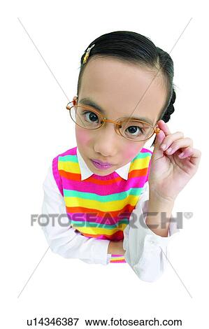 Stock Photo - Brown Hair, Casual Clothing, Warm Clothing, Eyeglasses, Portrait, Adjusting. Fotosearch