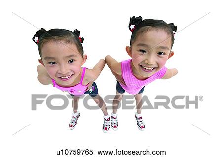 Stock Photography - Child, Arms Akimbo, Casual Clothing, Brown Hair, Asian Ethnicity, Children Only, 3-4 Years. Fotosearch