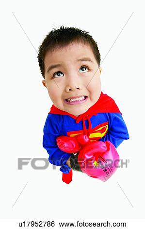 Stock Photograph - Clenching Teeth, Asian Ethnicity, Child, Brown Hair, Boxing Glove, Clipping Path, 3-4 Years. Fotosearch