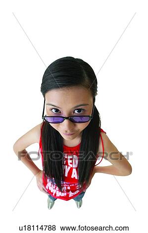 Stock Photo - Asian Ethnicity, Clipping Path, Casual Clothing, Black Hair, Arms Akimbo. Fotosearch