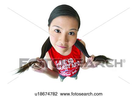 Stock Image - Casual Clothing, One Person, Holding, Posing, Looking At Camera, Cut Out, Brown Hair. Fotosearch