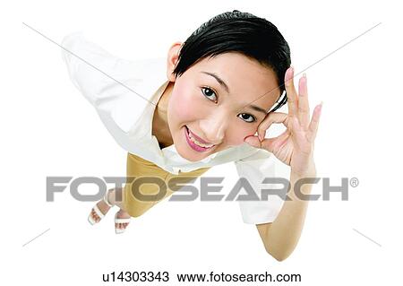 Stock Image - Cheerful, Beautiful, Casual Clothing, Button Down Shirt, Black Hair, Asian Ethnicity. Fotosearch