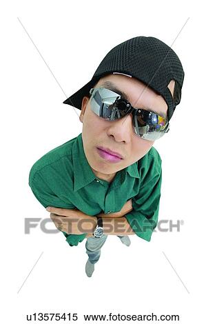 Stock Photography - Clipping Path, Asian Ethnicity, Casual Clothing, Button Down Shirt, Baseball Cap, Arms Crossed. Fotosearch