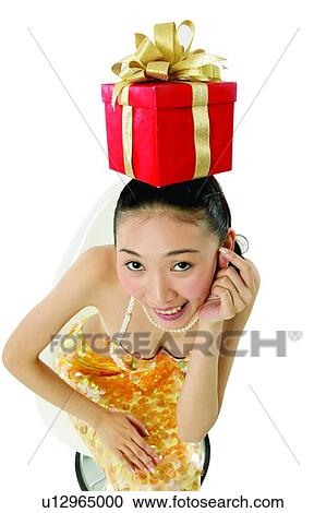 Stock Image - Clipping Path, Black Hair, Cheerful, Chair, Casual Clothing, Asian Ethnicity. Fotosearch