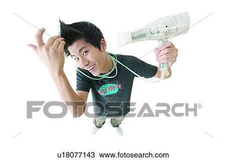 Hair Care, Holding, Looking Up, Smiling, Touching, One Teenage Boy Only View Large Photo Image Stock Image - Hair Care, Holding, Looking Up, Smiling, Touching, One Teenage Boy Only. Fotosearch