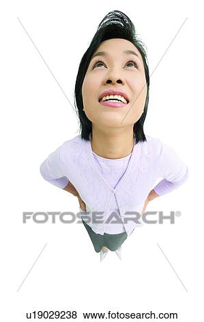 Stock Photo - Indoor, Long Hair, White Background, One Young Woman Only, Focus Faces. Fotosearch