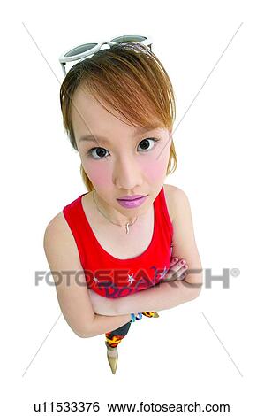 Stock Photograph - Lifestyles, One Person, Young Adult, Asian Ethnicity, Fashion, Arms Crossed. Fotosearch