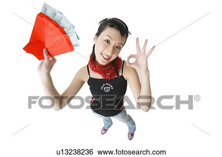 Stock Photograph - Bundle, Agreement, Black Hair, Beautiful, Asian Ethnicity, Casual Clothing, 18-19 Years. Fotosearch