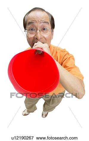 Stock Photo - Close-Up, Asian Ethnicity, Casual Clothing, Bullhorn, Balding, Announcement Message. Fotosearch