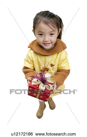 Elementary Age, Cute, Holding, Black Hair, Cut Out View Large Photo Image Stock Photograph - Elementary Age, Cute, Holding, Black Hair, Cut Out. Fotosearch