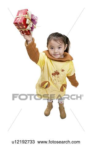 Stock Image - Indoor, Focus Property, Gift, Property, Asian Ethnicity, Posing. Fotosearch