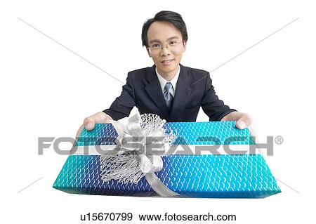 Stock Photo - Shirt And Tie, Young Adult, Focus Property, Indoor, Looking At Camera, Wrapped. Fotosearch