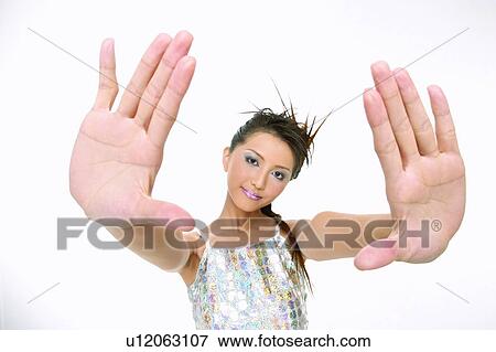 Stock Photo - Casual Clothing, Arm Outstretched, Brown Hair, Braids, Asian Ethnicity, 18-19 Years. Fotosearch