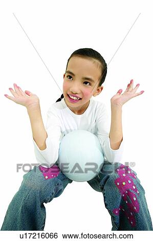 Stock Photograph - Cheerful, Asian Ethnicity, Casual Clothing, Black Hair, Ball, Child, 10-11 Years. Fotosearch