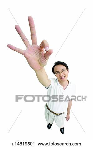Stock Image - Hand Raised, Indoor, One Person, Gesturing, Communication. Fotosearch