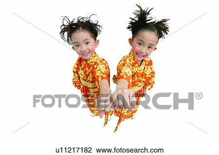 Indoor, Smiling, Cute, Traditional Clothing, Back To Back View Large Photo Image Stock Image - Indoor, Smiling, Cute, Traditional Clothing, Back To Back. Fotosearch