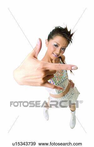 Stock Photo - Portrait, Skirt, Human Finger, Legs Apart, One Person, White Background. Fotosearch